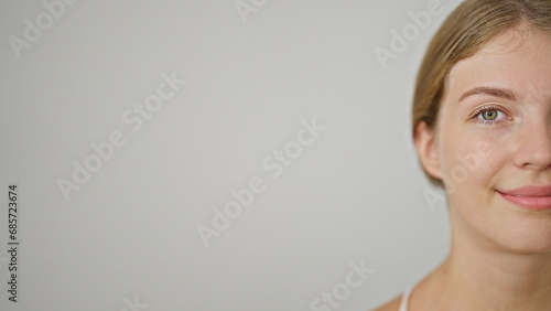 Young blonde woman smiling confident standing over isolated white background