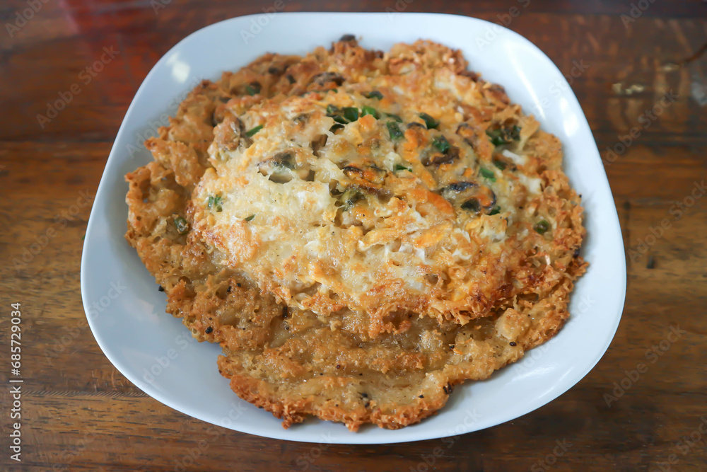 Oyster omelette or stir fried Oyster with egg and vegetable, shell omelet or deep fried flour with Oyster Oyster omelette or stir fried Oyster with egg and vegetable, shell omelet or deep fried flour with Oyster