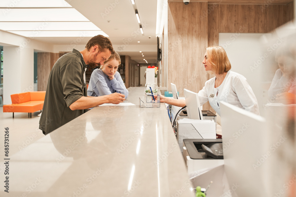 custom made wallpaper toronto digitalPatients signing agreement and talking to professional receptionist in clinic