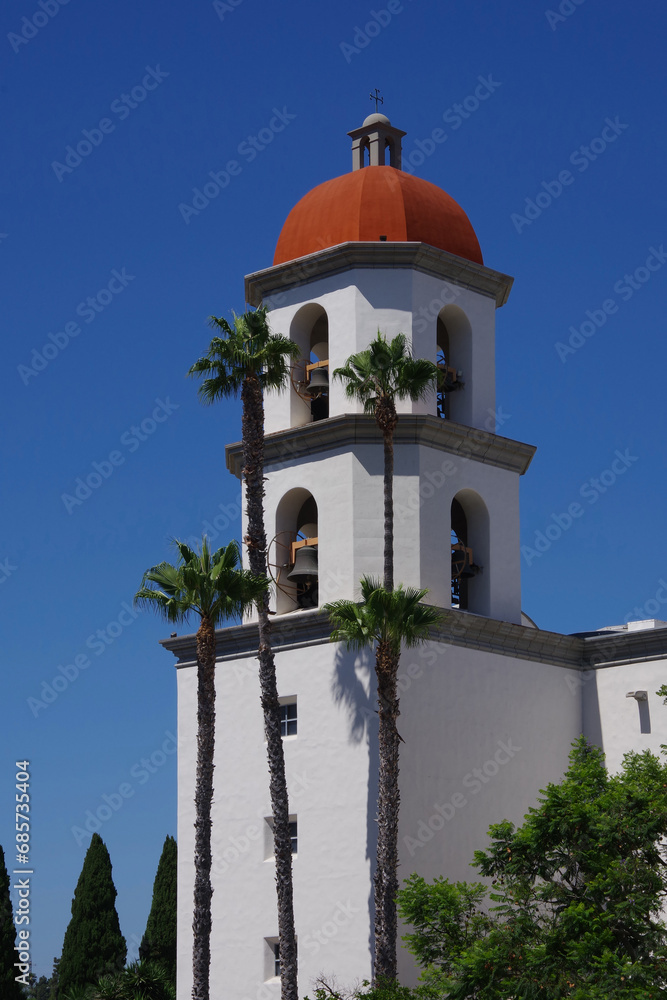 Church bell tower under blue sky in southern California