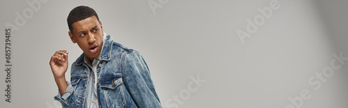 good looking emotional african american male model in denim outfit, fashion concept, banner