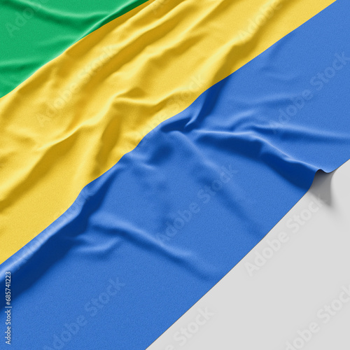 Flag of Gabon. Fabric textured Gabon flag isolated on white background