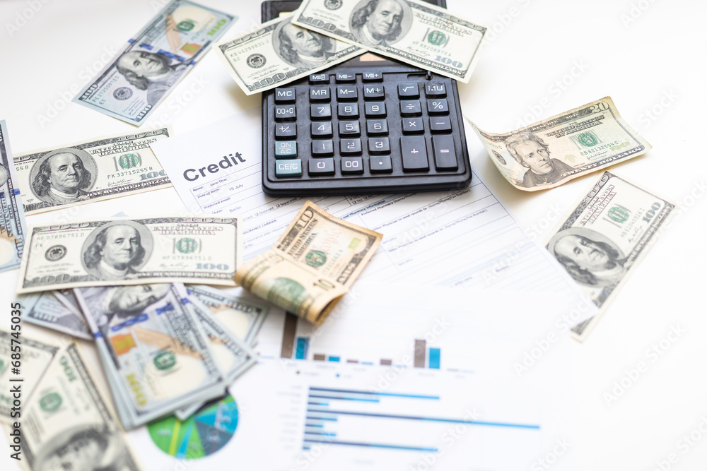 business graph chart paper pen calculator us dollar on office desk. Checking financial reports. business graph chart paper pen calculator us dollar on office desk. Checking financial reports.