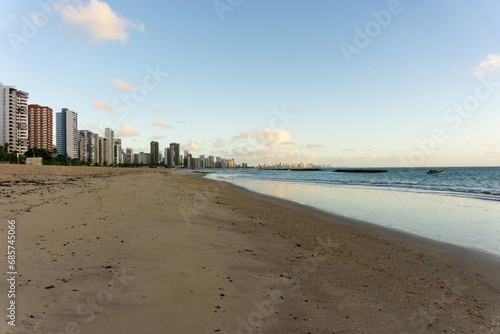 At the Beach of Candeias early in the morning, just after sunrise. The City of Recife, Brazil is to see in the background