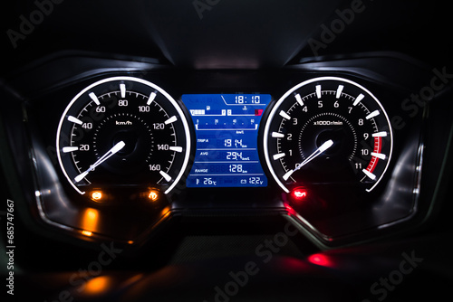 Light with car mileage with black background,number of speed,Odometer of car.