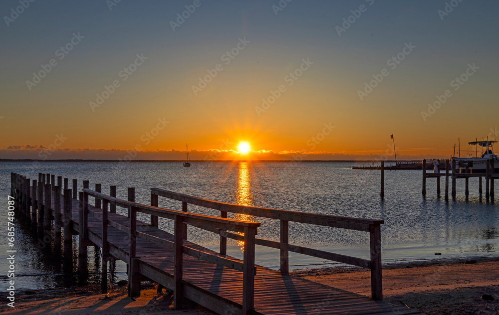 A Public Dock At Sunrise Time On Barnegat Bay In NJ