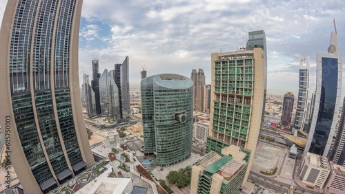 Panorama of Dubai international financial center skyscrapers aerial night to day timelapse. photo