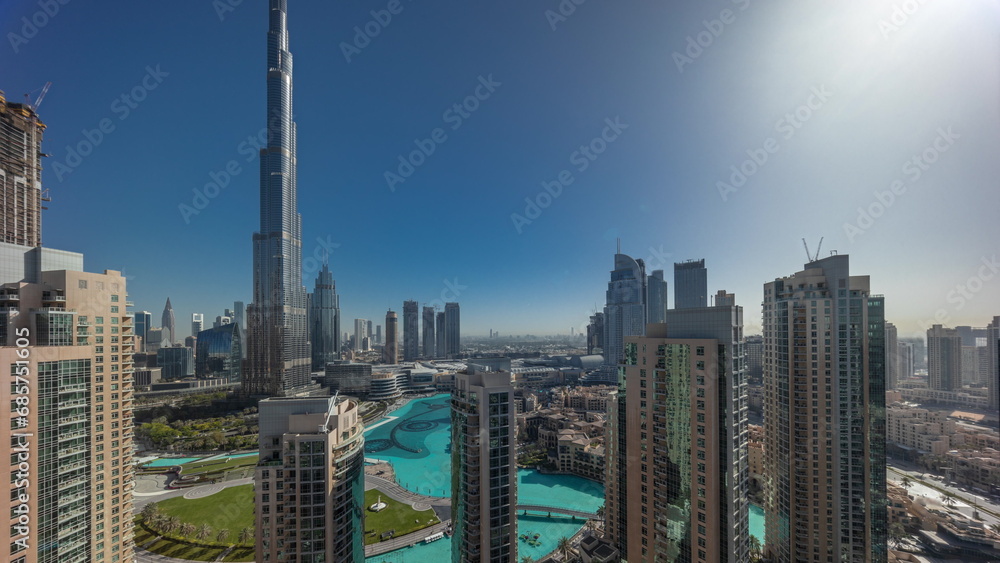 Dubai Downtown cityscape during sunrise with tallest skyscrapers around aerial timelapse