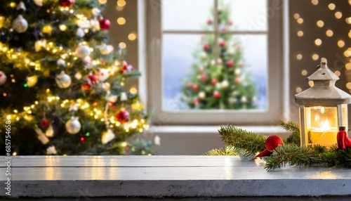 table space in front of defocused window sill with christmas tree