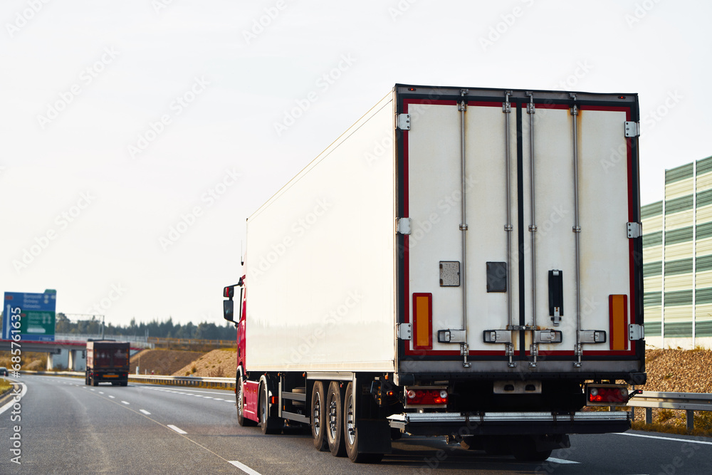 Efficient Ground Shipping. Trucking Through the Rural Landscape. Shipping company branding mock-up. Delivery Truck on the Countryside Highway. Trucking in Europe. Efficient Ground Shipping. Trucking Through the Rural Landscape. Shipping company branding mock-up. Delivery Truck on the Countryside Highway. Trucking in Europe.