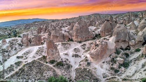 Panoramic view of fairy chimneys in Goreme Historical National Park. Goreme National Park and Rock Sites of Cappadocia, Central Anatolia, Nevsehir Province, Turkey. drone view. Ariel from above, top photo