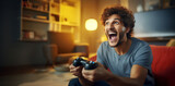 Excited young man playing video game and keeping mouth open while sitting on the couch at home. People lifestyle concept.