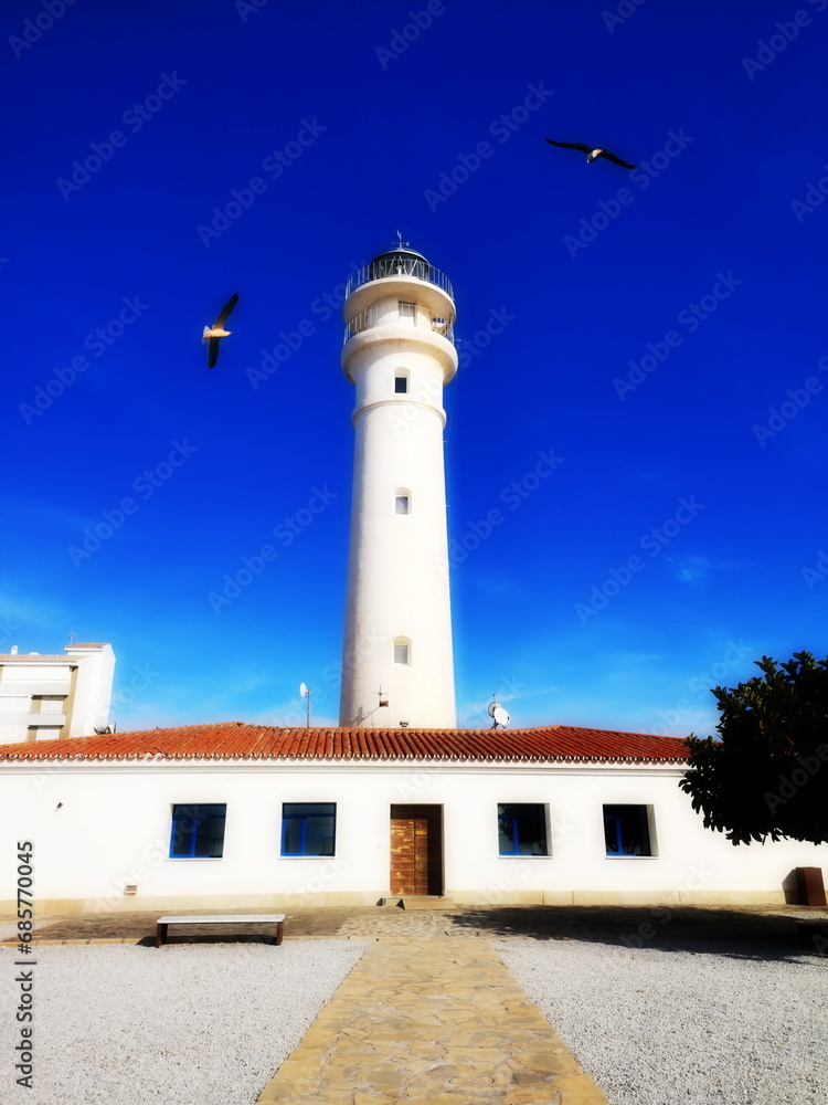 photo of the Torrox lighthouse, Malaga, Spain, blue sky, Mediterranean, diffuser filter,