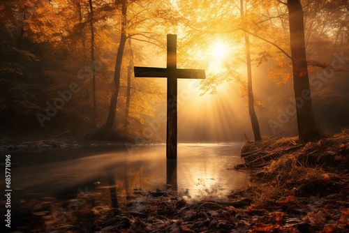 Cross in the forest with sun rays coming through the trees