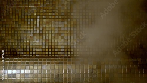 Misty steam room with a mystical golden glow.