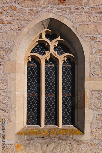 Photography Pointed gothic window arch with mouchette tracery at the village church of Abtwe