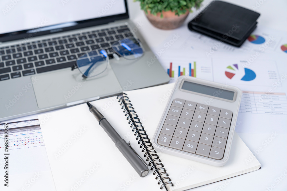 The calculator placed on the working desk. The calculator placed on the working desk.