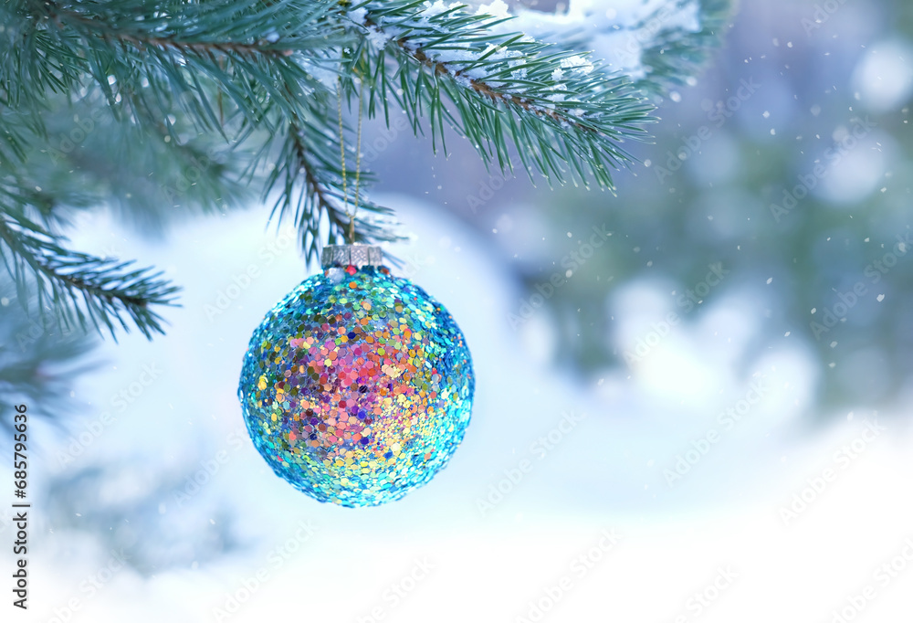 beautiful bright colorful shiny ball on snowy christmas tree close up. Winter nature background, festive season. Christmas and new year holidays beautiful bright colorful shiny ball on snowy christmas tree close up. Winter nature background, festive season. Christmas and new year holidays