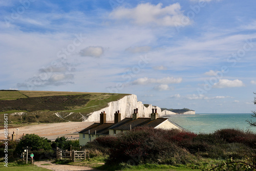 The Coastguard Cottages and Seven Sisters Cliffs, Cuckmere Haven, Seaford, United Kingdom. photo