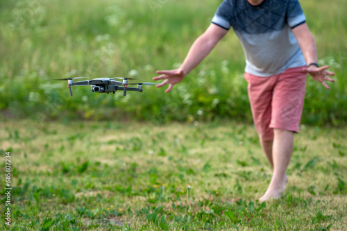 A man launches a drone into the air. The concept of remote control. Selective focus