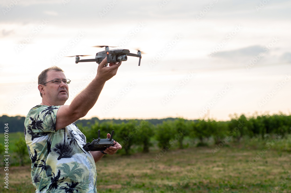 A drone lands on the hand of a man after a successful flight. A drone lands on the hand of a man after a successful flight.