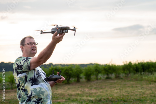 A drone lands on the hand of a man after a successful flight.