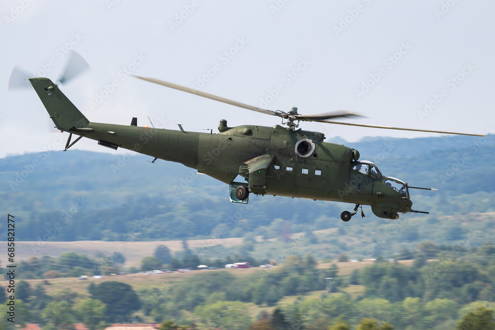 Untitled military helicopter at air base. Air force and army flight transportation. Aviation and rotorcraft. Transport and airlift. Military industry. Fly and flying. Untitled military helicopter at air base. Air force and army flight transportation. Aviation and rotorcraft. Transport and airlift. Military industry. Fly and flying.
