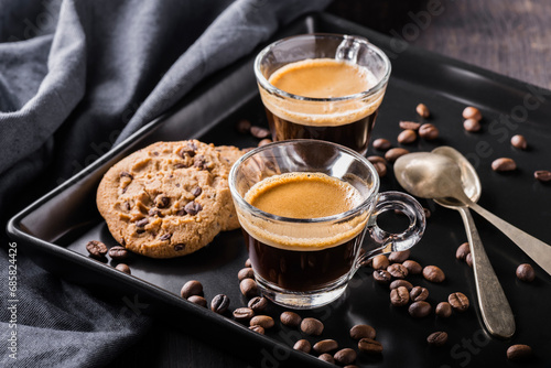 espresso coffee in glass cup and chocolate chip cookies photo