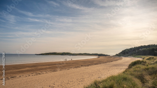 A bright day on the coast at Ynys Llanddwyn, Angelsey, North Wales. Also known as Newborough Beach photo