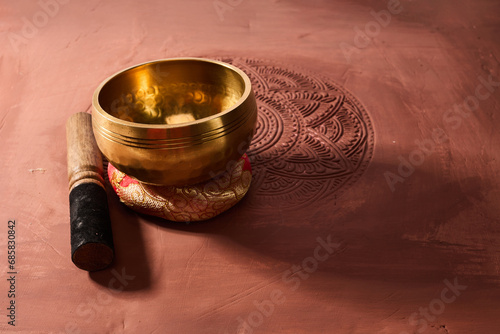A close up of a tibetan singing bowl or himalayan bowl for therapy, meditation and relaxation.