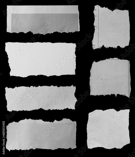 Torn papers on black photo