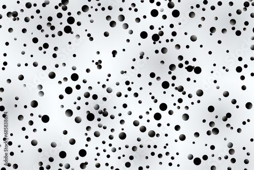 Various sized black dots on white background