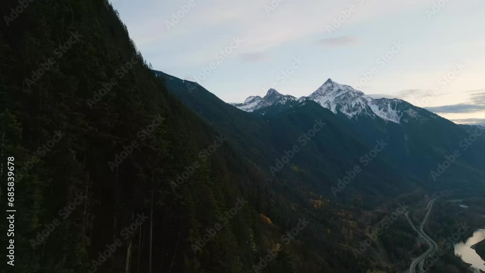 Scenic Valley by the River, surrounded by Mountains. Sunset, Fall Season. Aerial Landscape. Fraser Valley, British Columbia Canada Scenic Valley by the River, surrounded by Mountains. Sunset, Fall Season. Aerial Landscape. Fraser Valley, British Columbia Canada