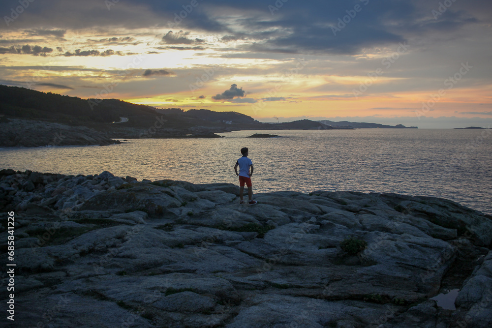 kid enjoying magical moments at sunset kid enjoying magical moments at sunset