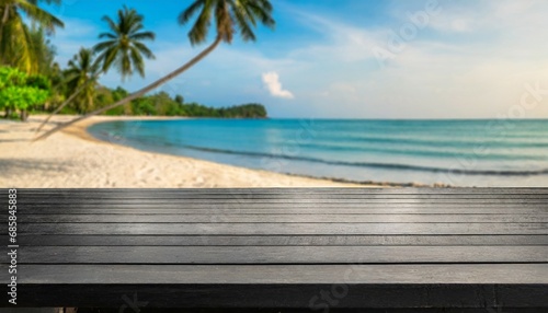 wooden black table top on blur tropical beach background can be used for display or montage your products high quality photo © Florence