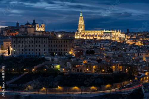 Panoramic view of the historic center of Toledo, Spain, at night with its illuminated Santa Maria Cathedral and San Ildefonso Church. UNESCO World Heritage Site © Gustavo Muñoz