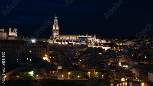 Panoramic view of the historic center of Toledo  Spain  at night with its illuminated Santa Maria Cathedral and San Ildefonso Church. UNESCO World Heritage Site