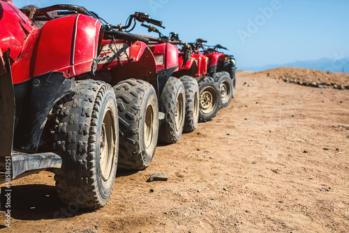 Red quads stand in a row on the shore of the Red Sea. Dahab  Egypt.