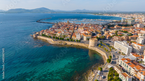 Aerial view of the old town of Alghero in Sardinia. Photo taken with a drone on a sunny day. Panoramic view of the old town and harbor of Alghero, Sardinia, Italy. photo