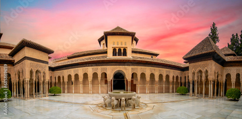Panoramic view of the Patio de los Leones of the Alhambra palace, Granada, Andalusia, Spain at dusk