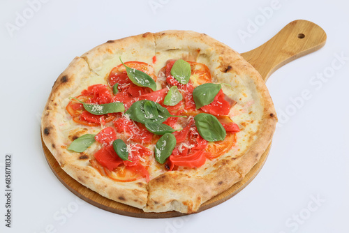 Hot and delicious pizza with white sauce, tomatoes, prosciutto and pickled ginger on a thin dough on white background