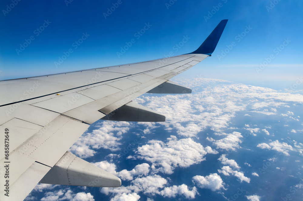 Fototapeta premium Wing of an airplane in the sky
