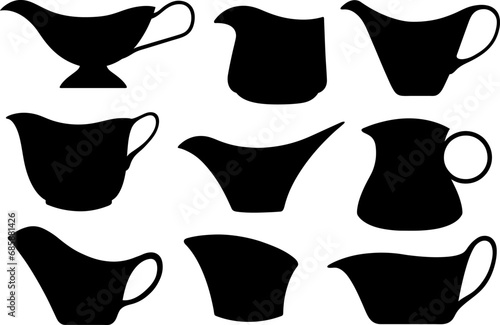 Collage of different gravy sauce boats isolated on white photo