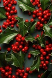 red background with holly leaves and berries