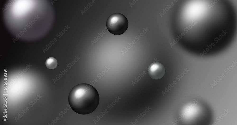 Multi-colored beads and pearls floating in the air with depth of field. Abstract silver and black color spheres levitating and moving over grey background. Multi-colored beads and pearls floating in the air with depth of field. Abstract silver and black color spheres levitating and moving over grey background.