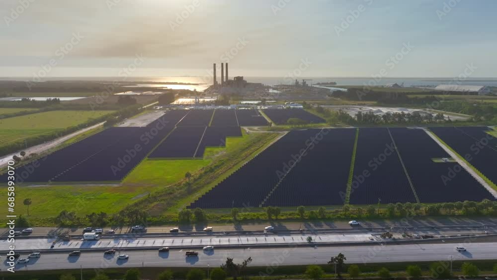 View from above of photovoltaic power plant with many rows of solar panels for producing clean electrical energy. Concept of renewable electricity with no air pollution View from above of photovoltaic power plant with many rows of solar panels for producing clean electrical energy. Concept of renewable electricity with no air pollution
