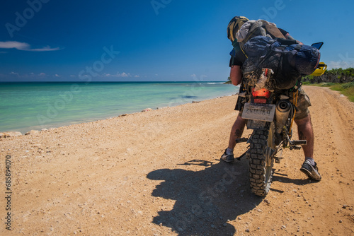off road motorcycle travel adventure with sea and sand path 
