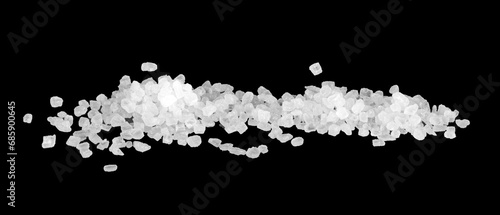 White coarse sea salt isolated on a black background. photo