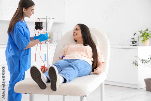 Female nurse preparing youn...