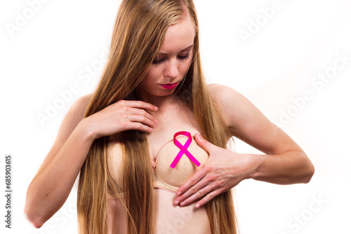 Woman chest in bra, pink cancer ribbon © Voyagerix